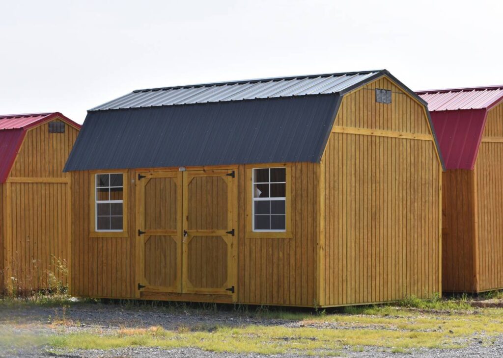 Treated Derksen lofted barn sheds at Tiny Hive in Giddings, TX