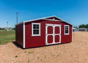 Red best value wood shed for sale at Tiny Hive in Giddings
