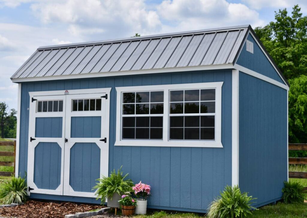 Blue Derksen cottage sheds in Texas with flowers box