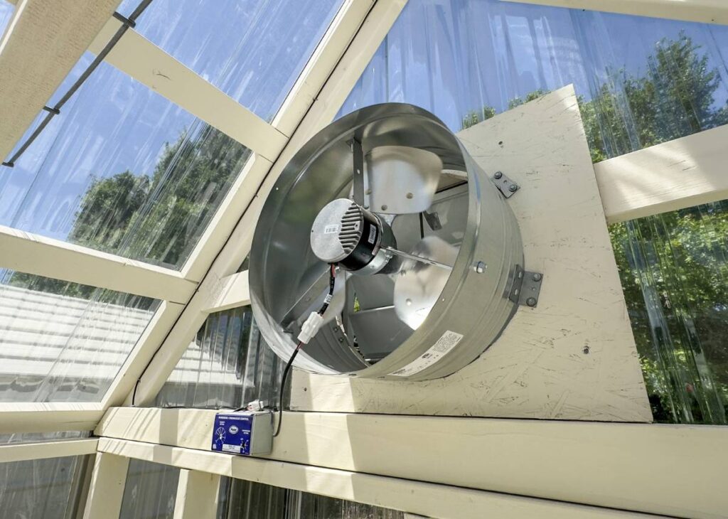 Fan in greenhouse at Tiny Hive in Giddings, TX