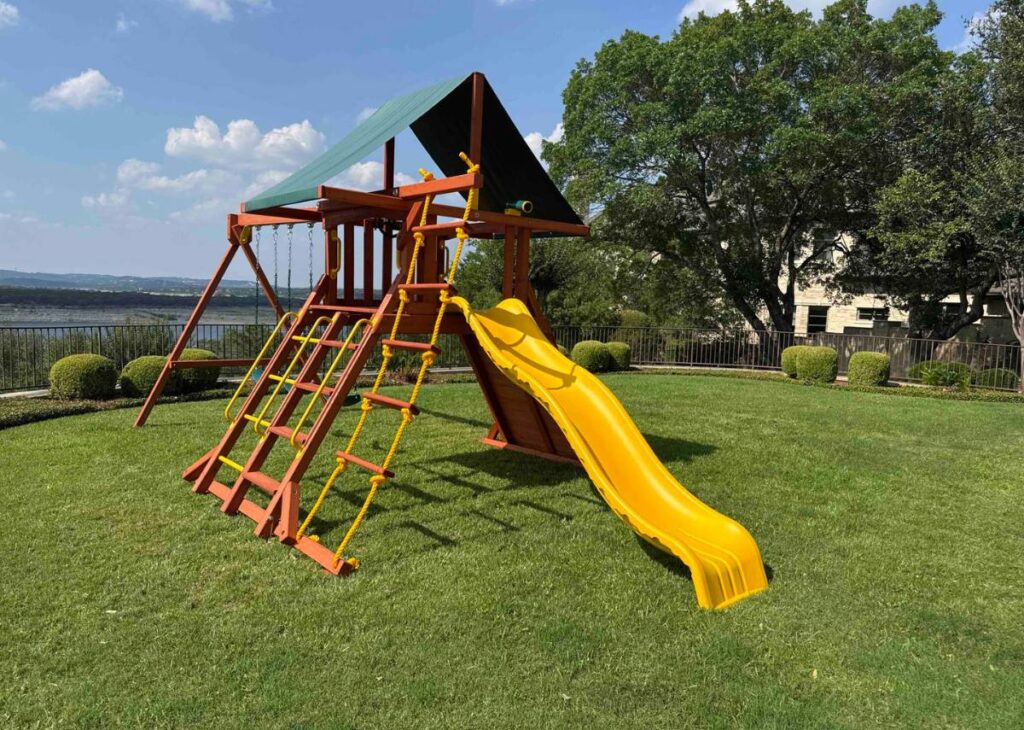 Wooden swing set at Tiny Hive Giddings, TX