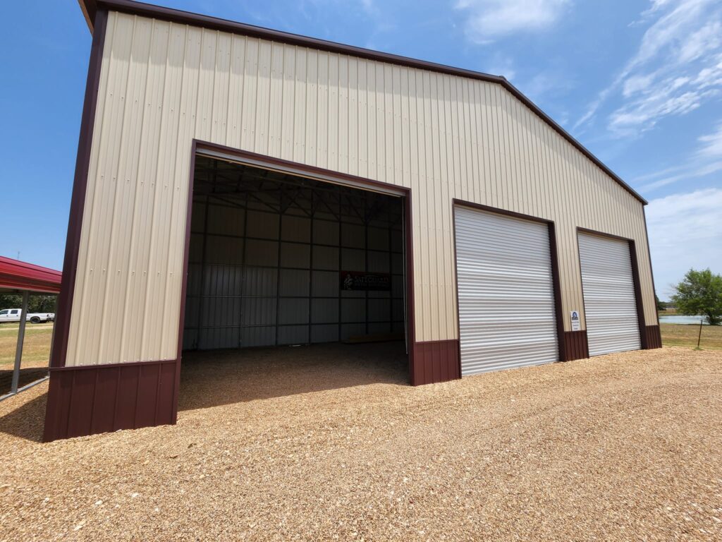 Large metal garage for sale at Tiny Hive in Giddings, TX