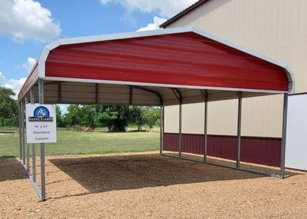 Red metal carport for sale at Tiny Hive in Giddings, TX